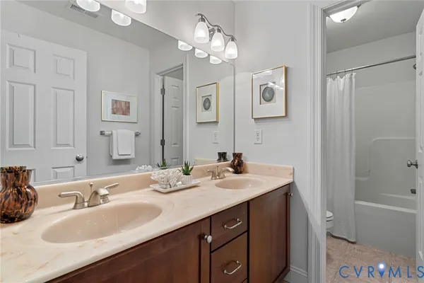 a living room with furniture a fireplace and a large window