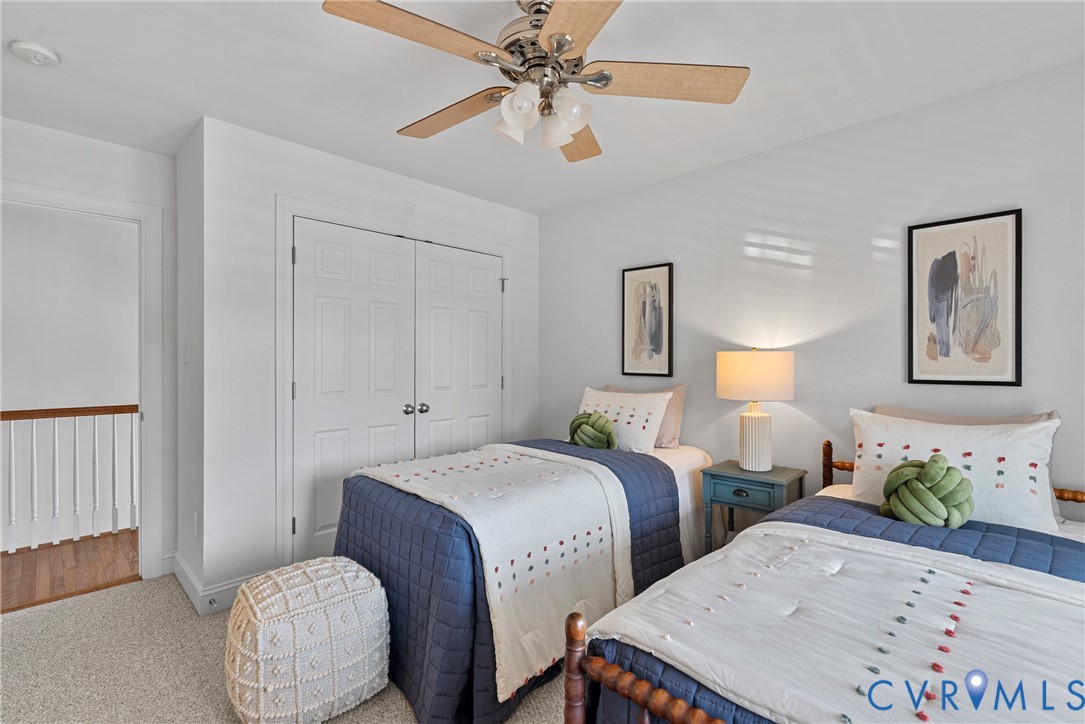 170 Rappa Run Road Topping, VA 23169 - Photo 37 of 60 a bedroom with two beds and painting on the wall