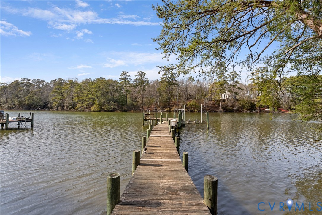 170 Rappa Run Road Topping, VA 23169 - Photo 4 of 60 a wooden pier with boats in a lake