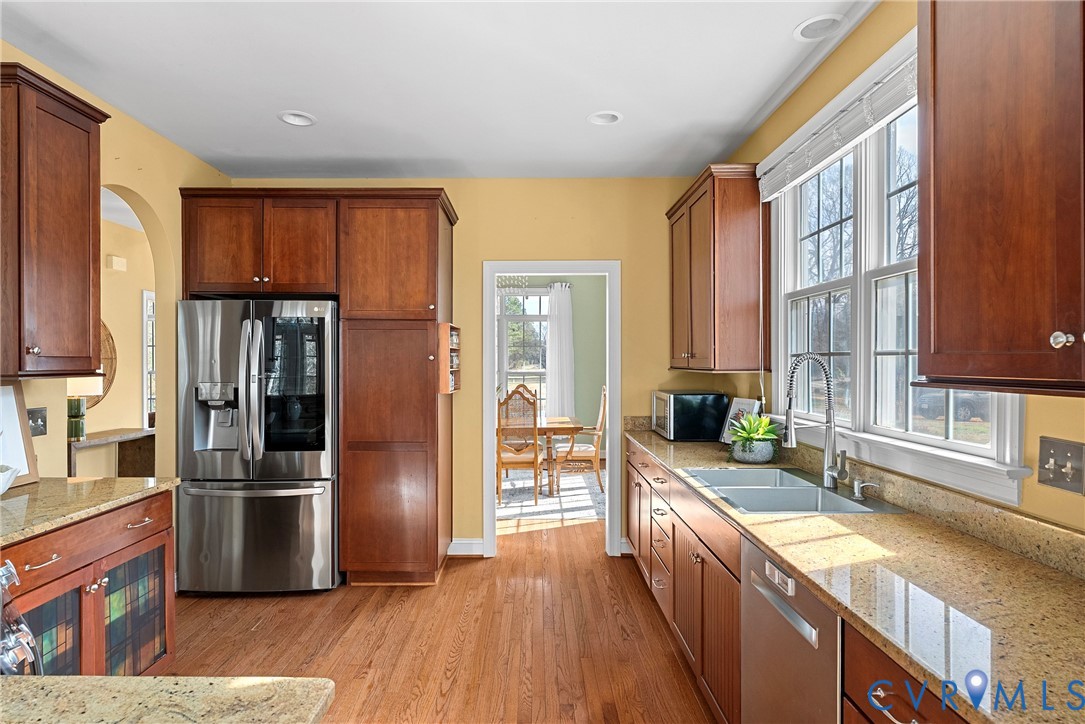 170 Rappa Run Road Topping, VA 23169 - Photo 43 of 60 a large kitchen with stainless steel appliances granite countertop a refrigerator a oven a sink and dishwasher with wooden floor