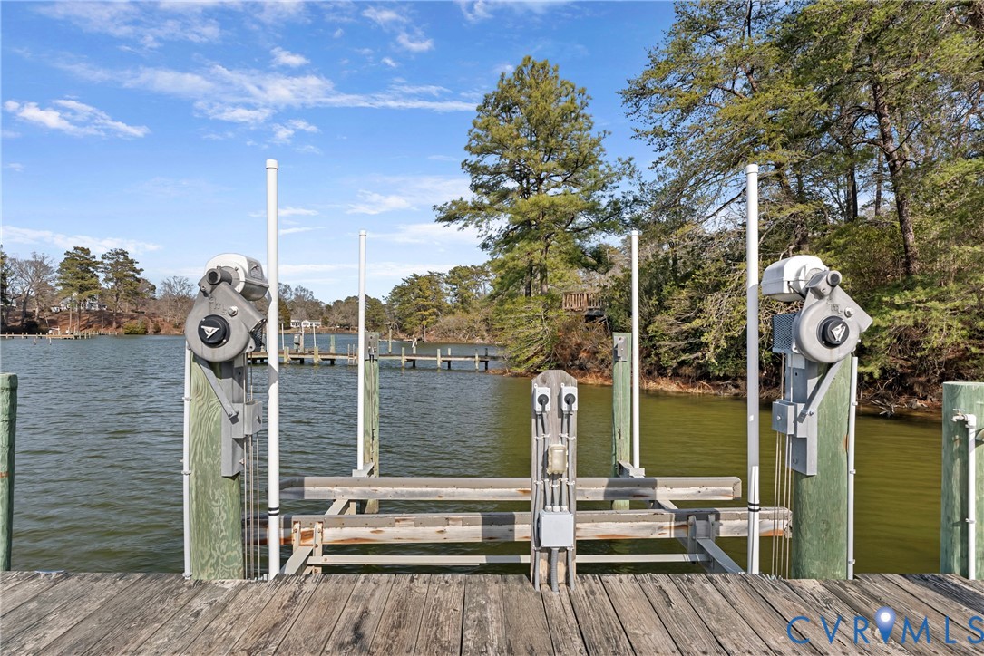 170 Rappa Run Road Topping, VA 23169 - Photo 52 of 60 a front view of a house with a garden