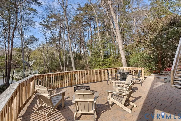 a living room with furniture fireplace and a large window