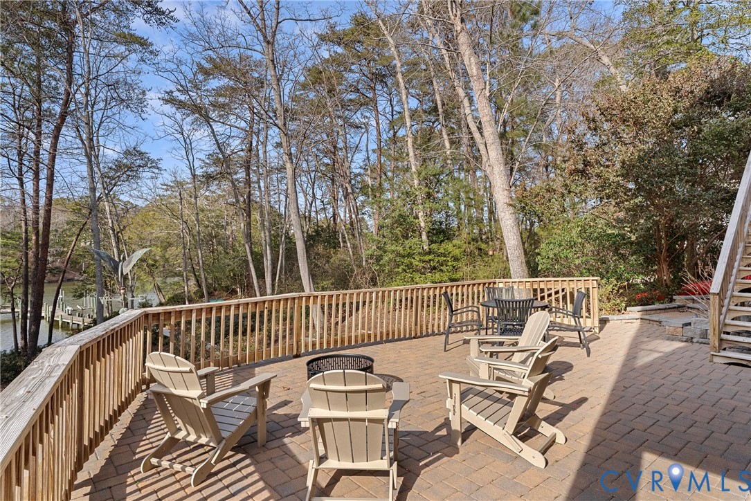 170 Rappa Run Road Topping, VA 23169 - Photo 6 of 60 a view of balcony with wooden floor and outdoor seating