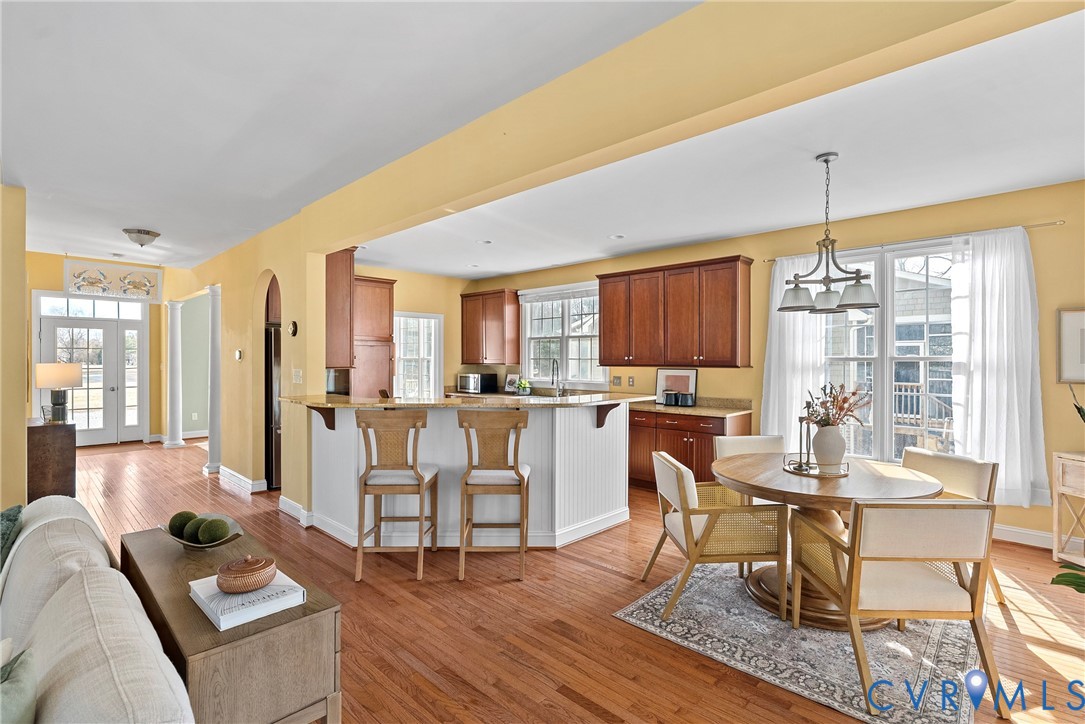 170 Rappa Run Road Topping, VA 23169 - Photo 10 of 60 a living room with furniture a rug and kitchen view