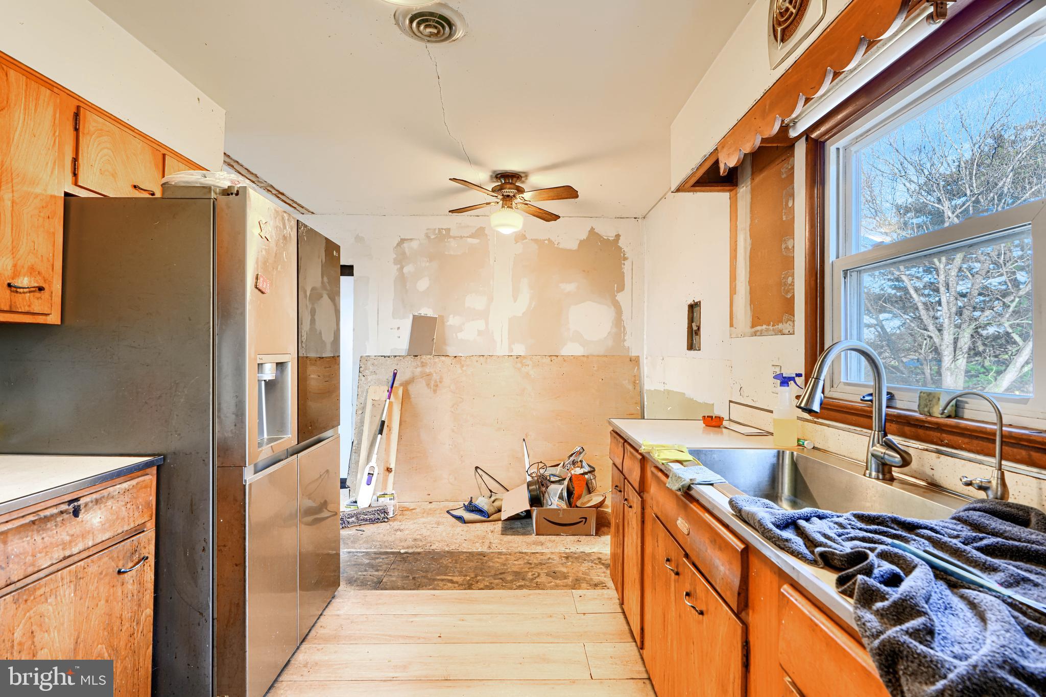 513 Round Top Road Chestertown, MD 21620 - Photo 7 of 18 a kitchen with stainless steel appliances granite countertop a stove a sink and a refrigerator