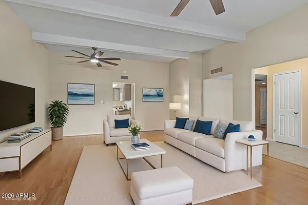 a living room with furniture and a flat screen tv