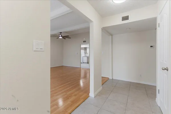 a kitchen with a sink a refrigerator and cabinets