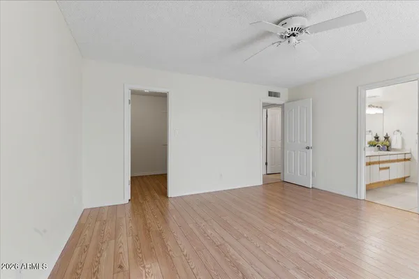 a view of a room with wooden floor