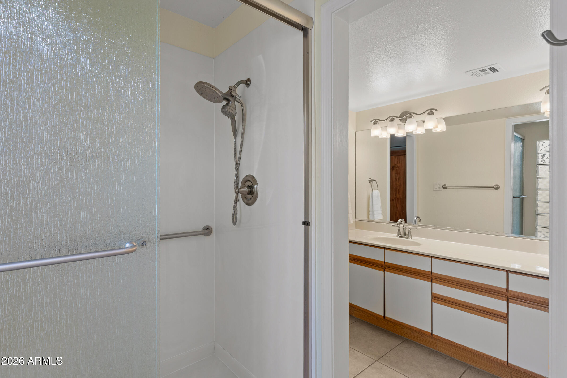 6512 North 12th Way Phoenix, AZ 85014 - Photo 15 of 39 a bathroom with a shower and a sink