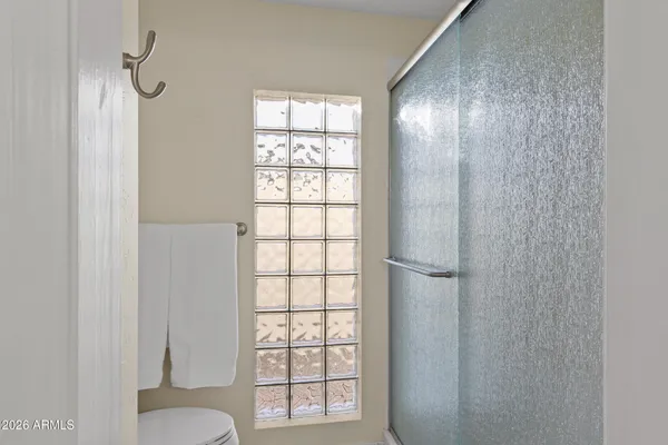a spacious bathroom with a double vanity sink and a mirror