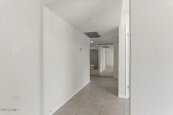 a bathroom with a window and a toilet