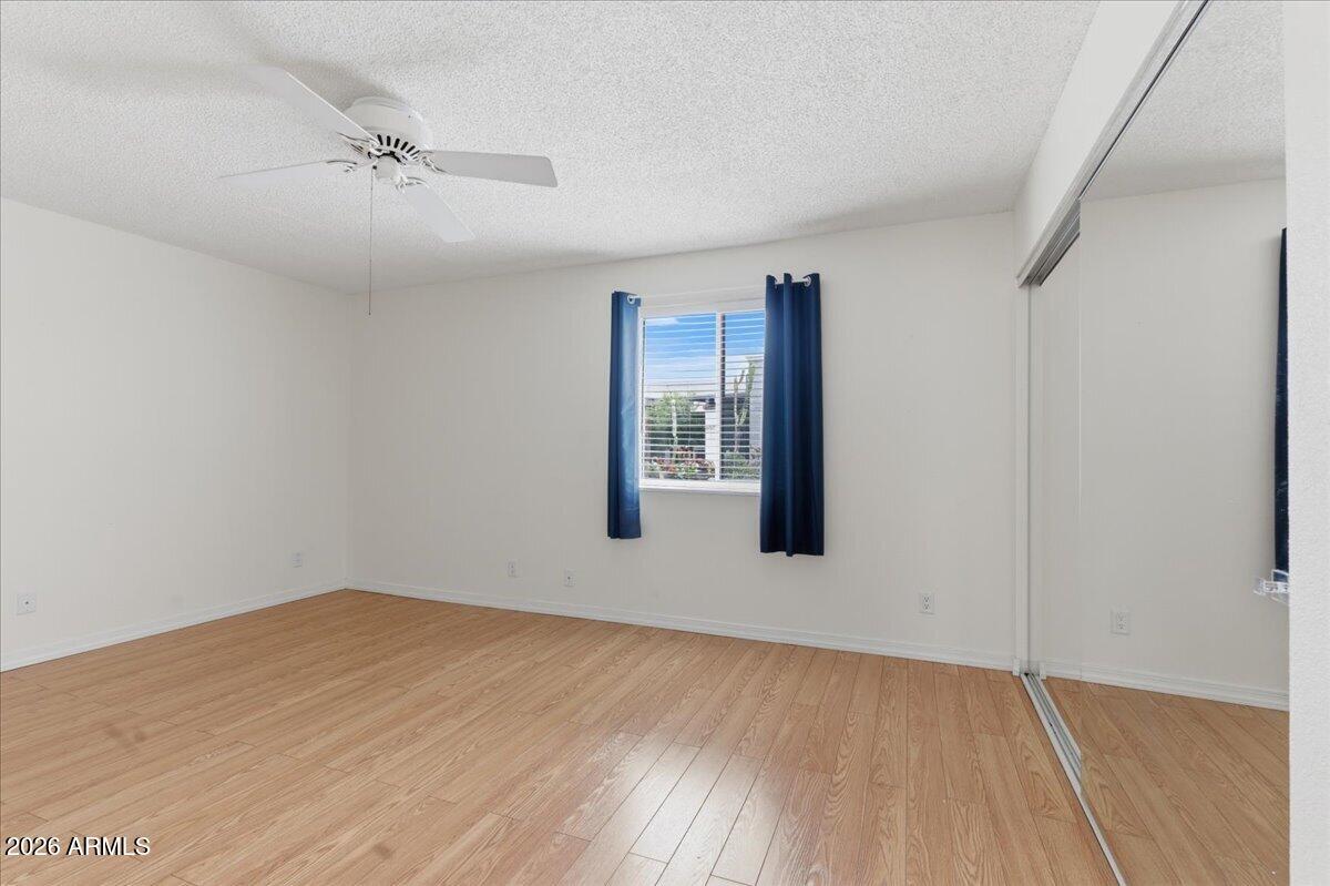 6512 North 12th Way Phoenix, AZ 85014 - Photo 21 of 39 a view of an empty room with a window
