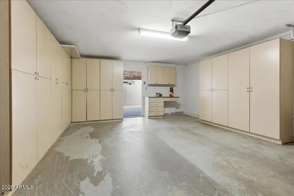 a patio with table and chairs