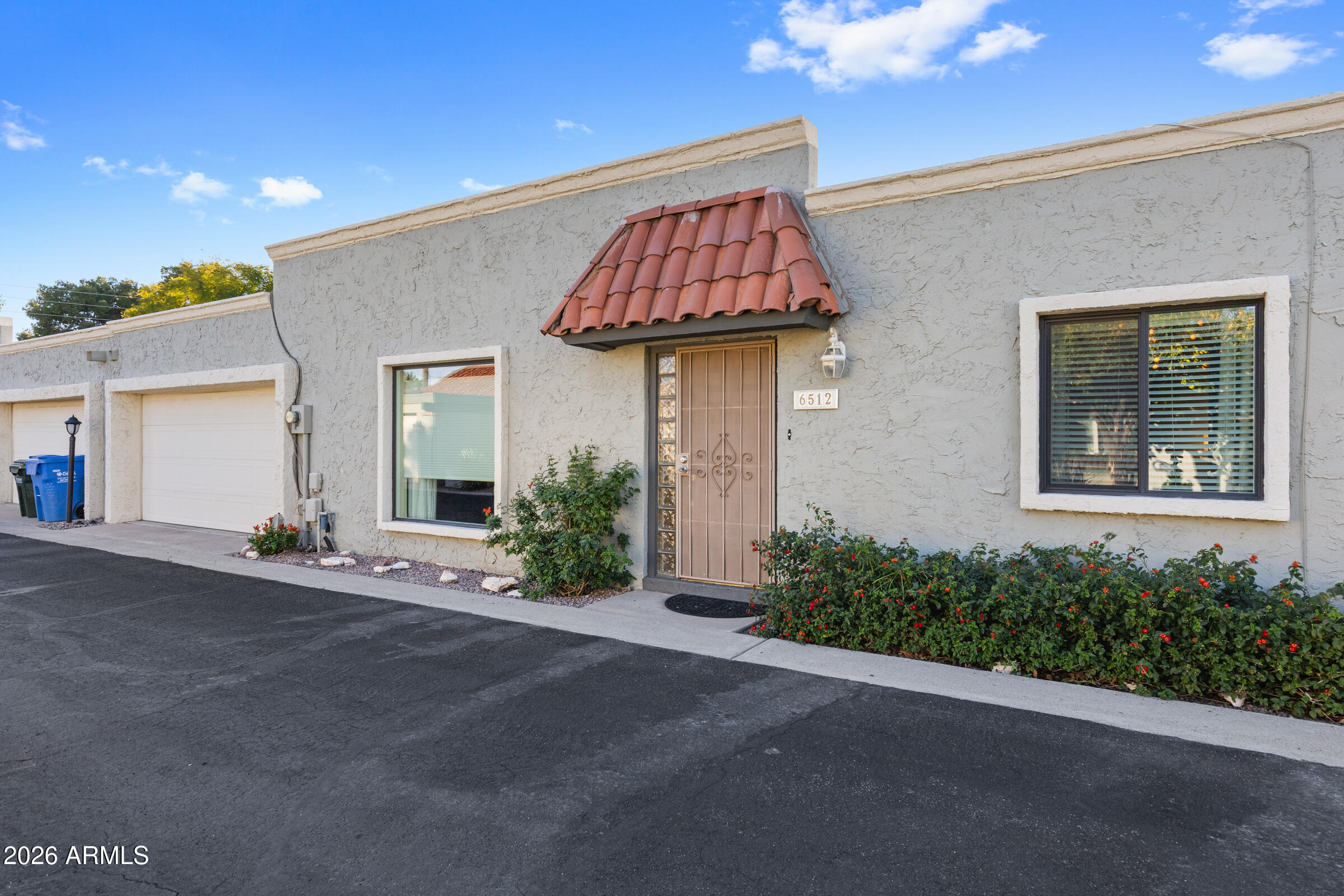 6512 North 12th Way Phoenix, AZ 85014 - Photo 31 of 39 a front view of a house with garden