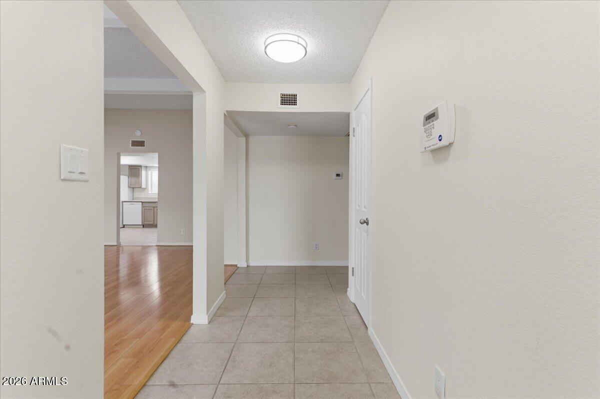 6512 North 12th Way Phoenix, AZ 85014 - Photo 8 of 39 a view of a hallway with wooden shelves