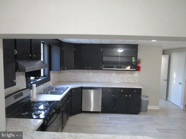 116 Sylvan Terrace Glassboro, NJ 08028 - Photo 3 of 7 a kitchen with stainless steel appliances granite countertop a sink and a stove