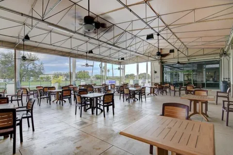 a outdoor space with lots of tables and chairs
