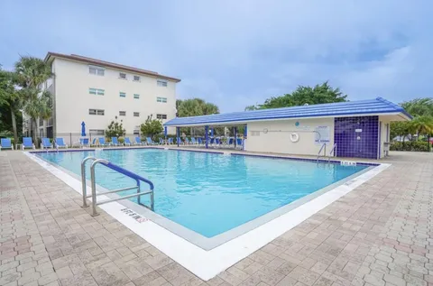 swimming pool view with a outdoor seating