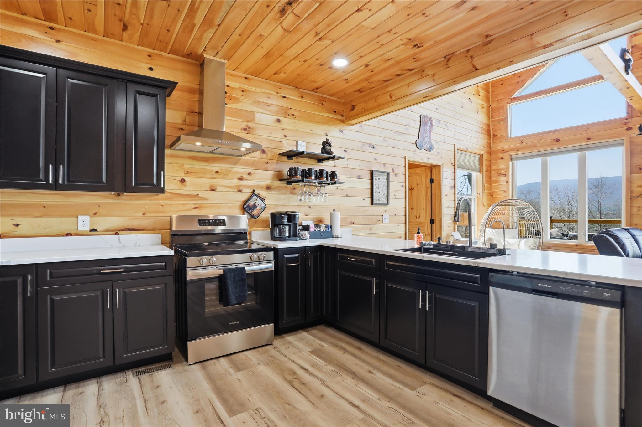 432 Lost Point Lane Berkeley Springs, WV 25411 - Photo 10 of 38 Striking black cabinets with quartz countertops