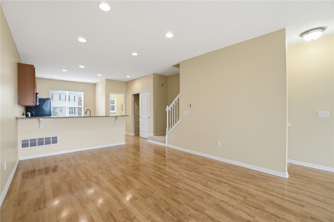 4324 Straight Arrow Road Dayton, OH 45430 - Photo 11 of 40 This inviting space offers a seamless flow with polished flooring, perfect for modern living and entertaining.