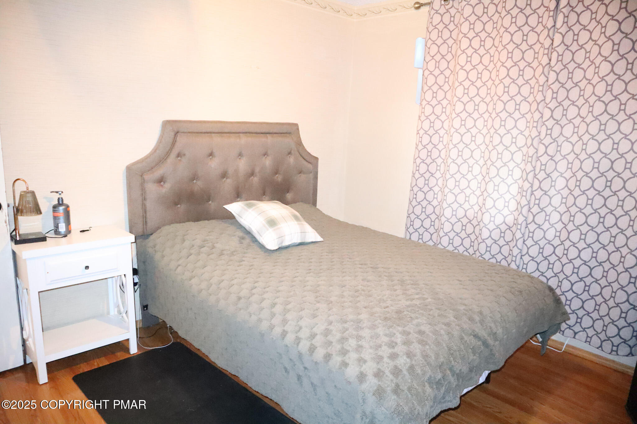 2116 Bobolink Trail Bushkill, PA 18324 - Photo 14 of 19 a bedroom with a bed and a night stand