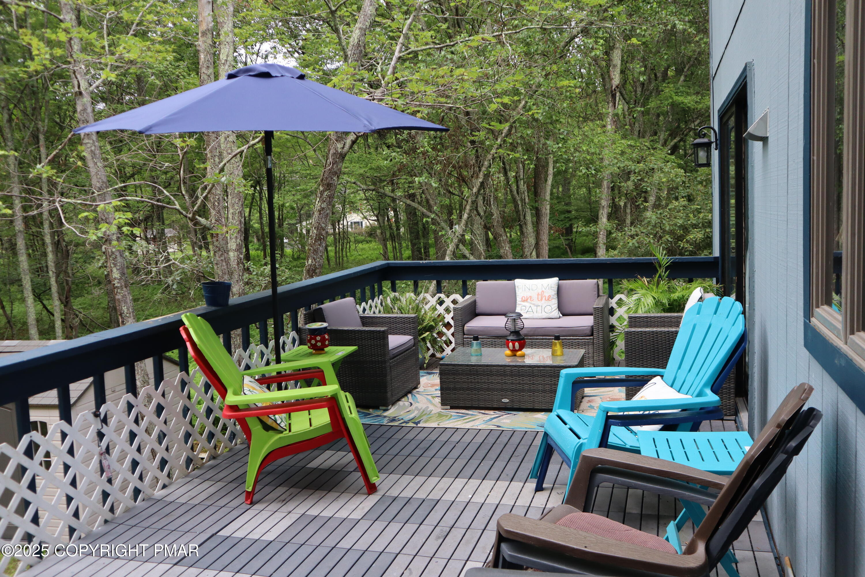 2116 Bobolink Trail Bushkill, PA 18324 - Photo 17 of 19 a view of deck with furniture and umbrella