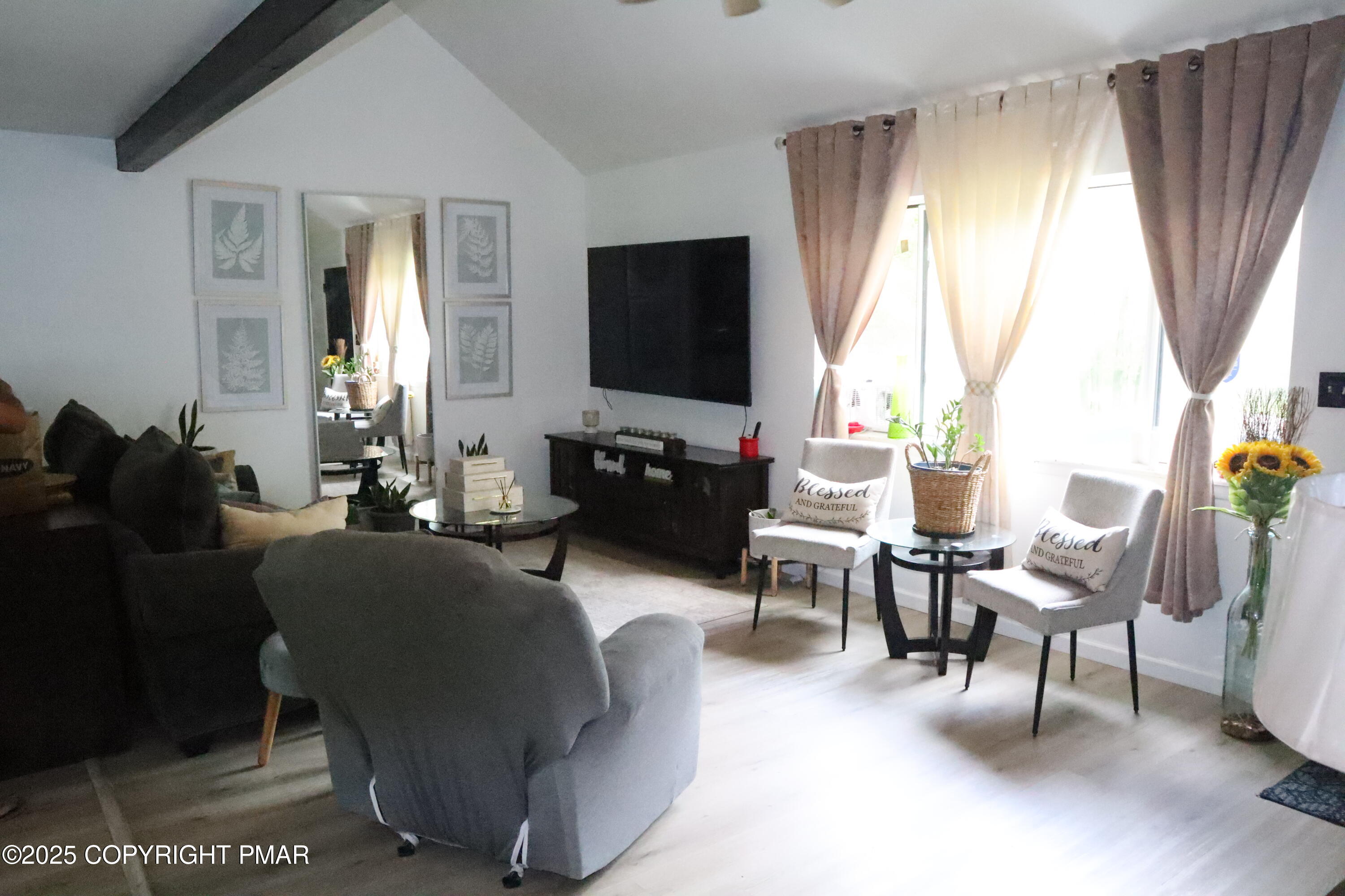 2116 Bobolink Trail Bushkill, PA 18324 - Photo 2 of 19 a living room with furniture and a flat screen tv