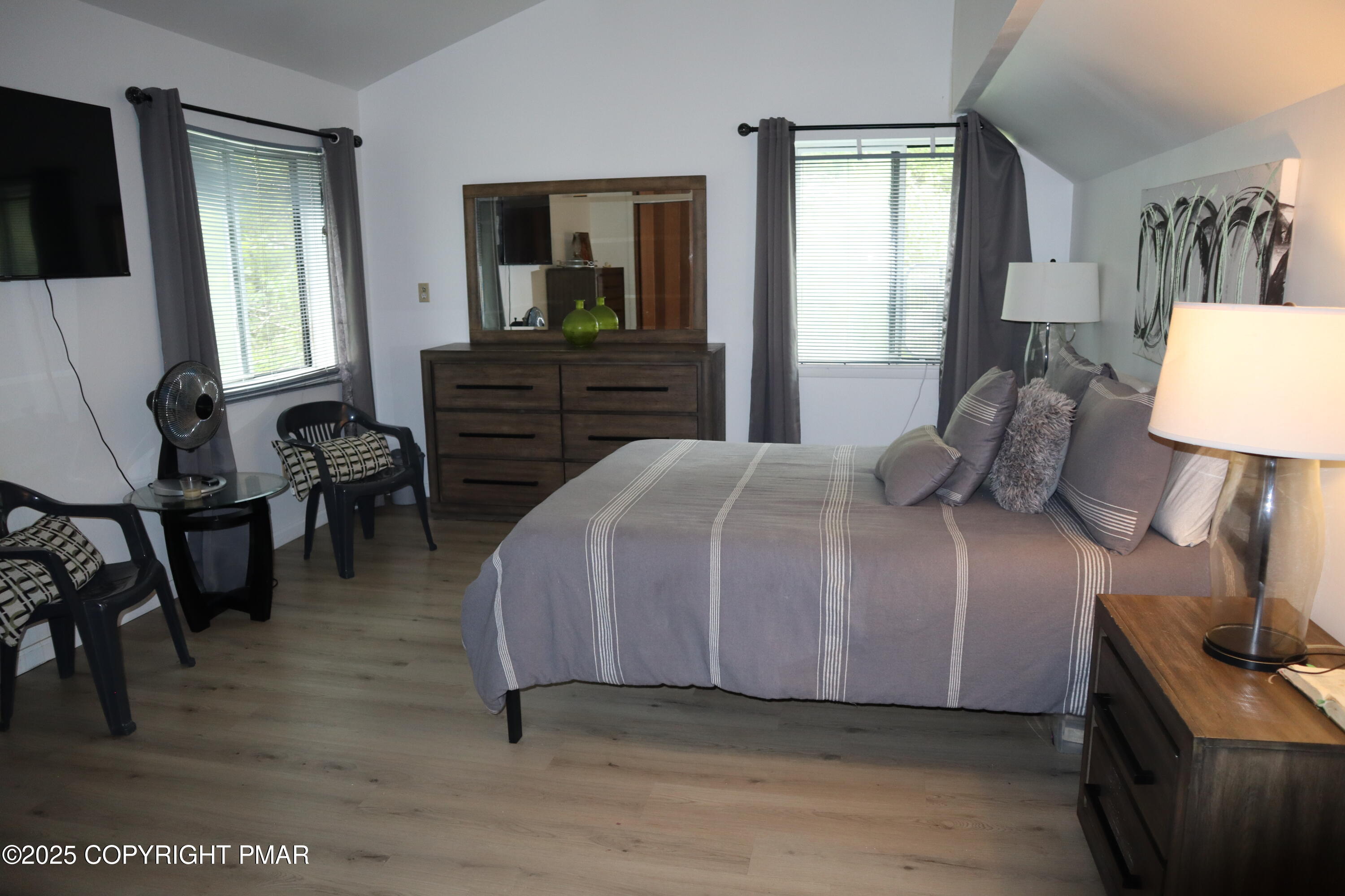 2116 Bobolink Trail Bushkill, PA 18324 - Photo 9 of 19 a bedroom with a bed and a mirror on dresser