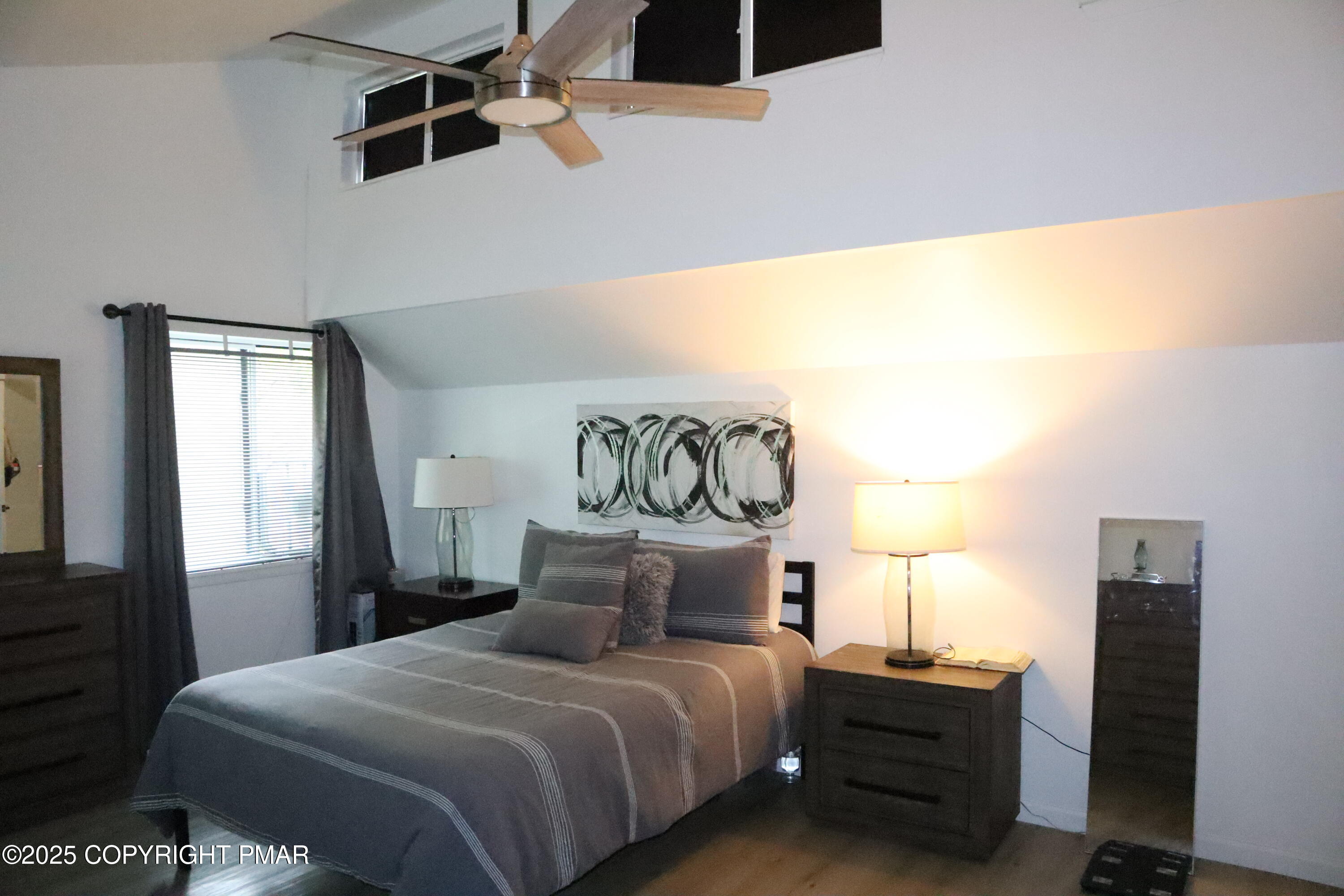 2116 Bobolink Trail Bushkill, PA 18324 - Photo 10 of 19 a bedroom with a bed and a painting on the wall