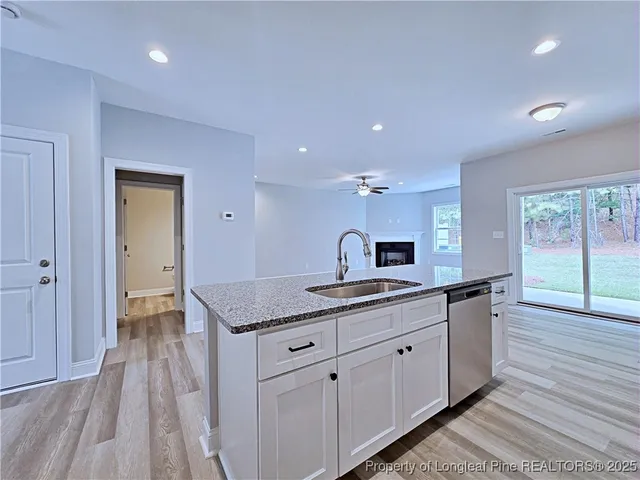a hallway with sink and mirror