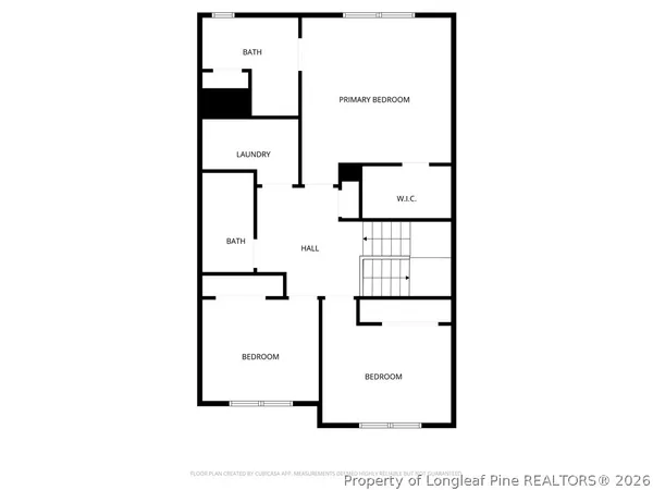 an empty room with closet and a chandelier fan