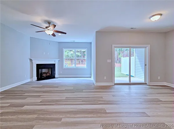 a kitchen with stainless steel appliances granite countertop a sink stove and wooden floor