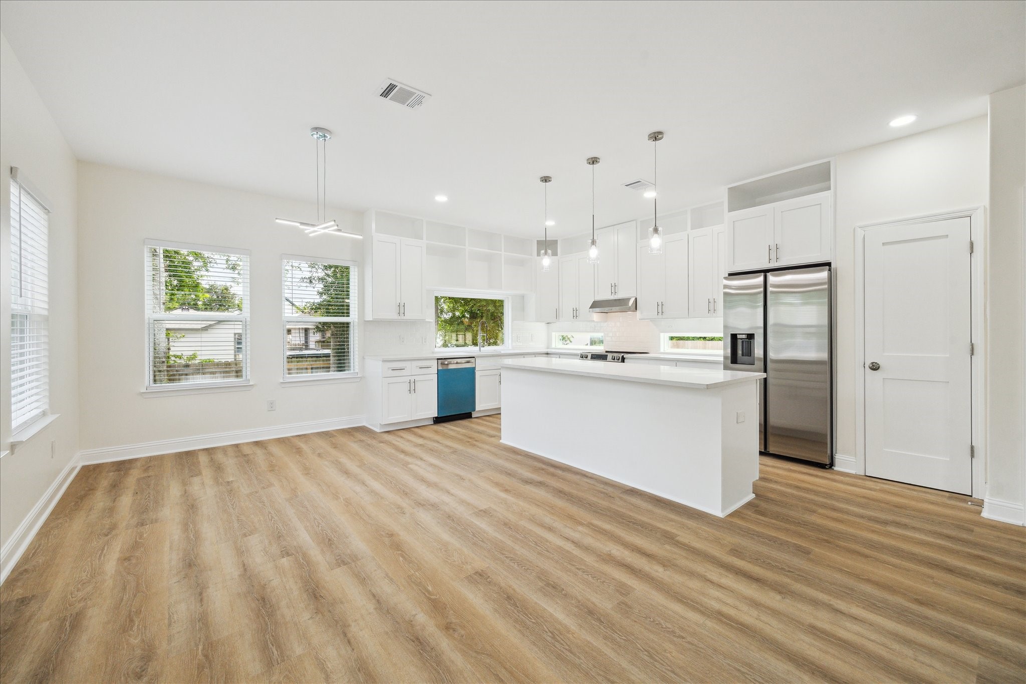 901 East 37th Street Houston, TX 77022 - Photo 6 of 19 a view of kitchen with wooden floor and window
