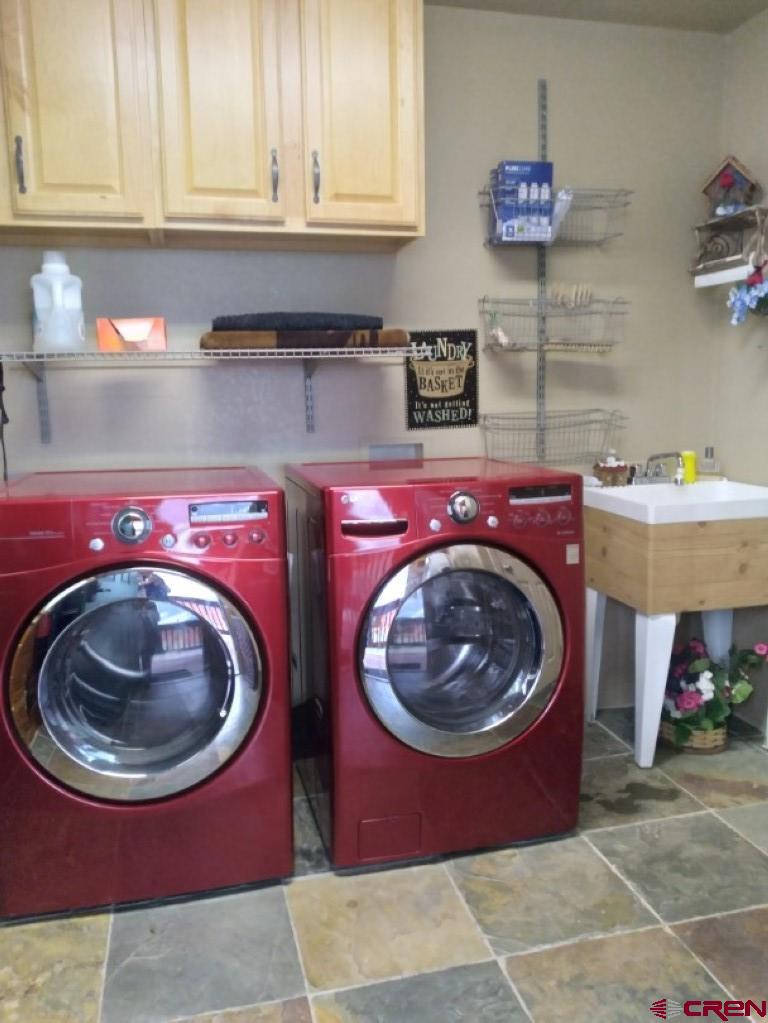 100 Crest Drive Cimarron, CO 81220 - Photo 15 of 35 a utility room with a sink dryer and washer