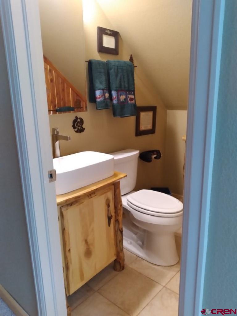 100 Crest Drive Cimarron, CO 81220 - Photo 23 of 35 a bathroom with a toilet and a sink