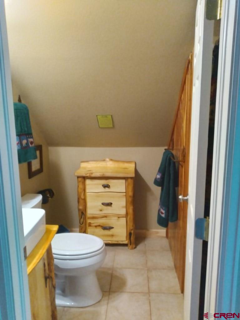 100 Crest Drive Cimarron, CO 81220 - Photo 25 of 35 a bathroom with a toilet and a shower