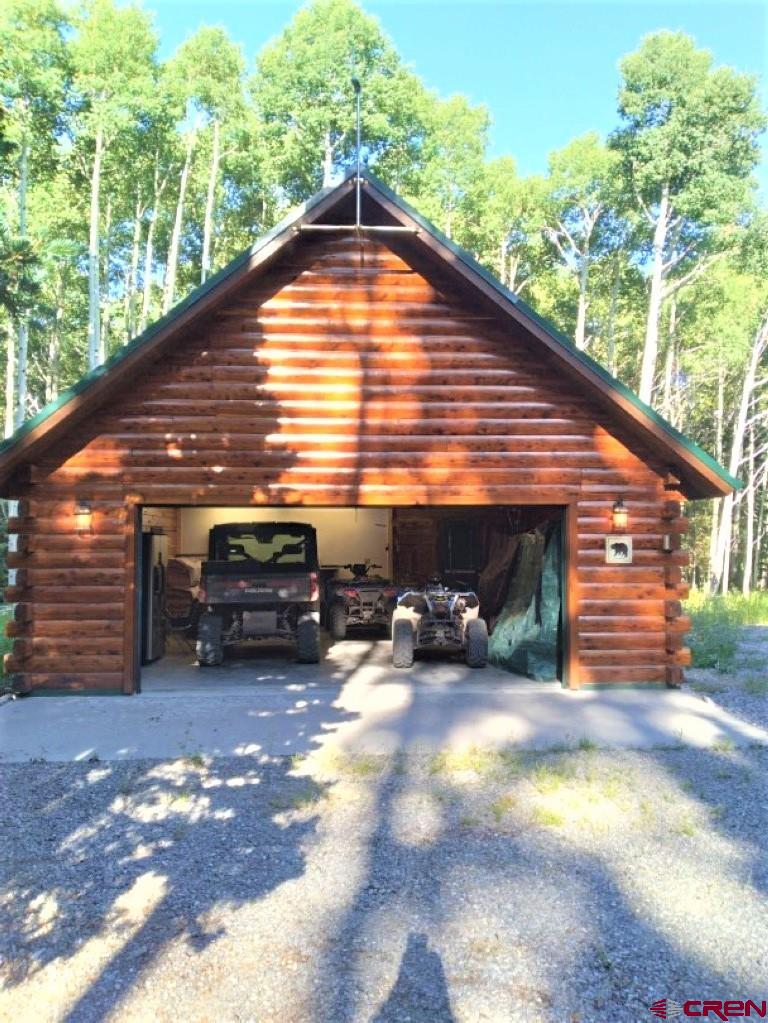 100 Crest Drive Cimarron, CO 81220 - Photo 30 of 35 a view of a house with a yard