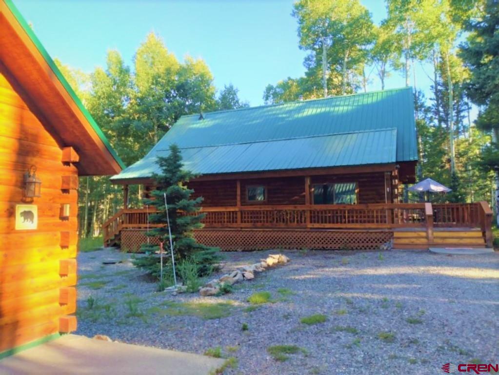 100 Crest Drive Cimarron, CO 81220 - Photo 34 of 35 a front view of a house with garden