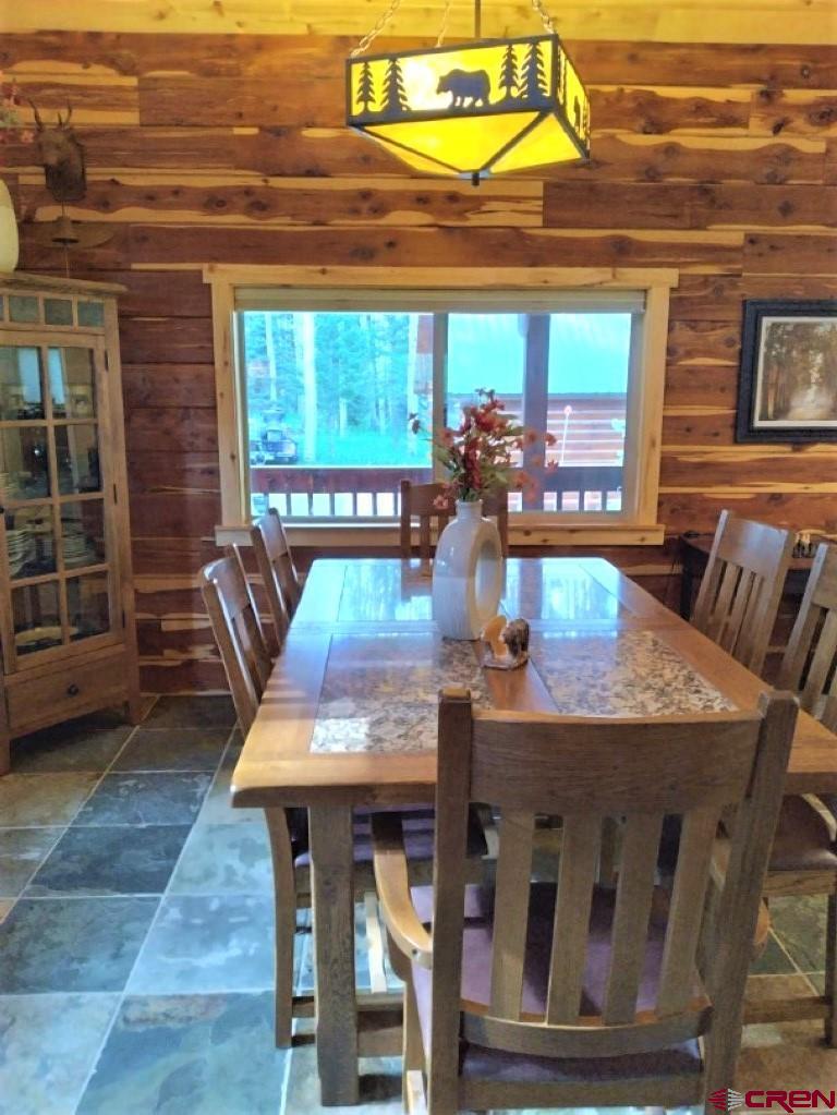 100 Crest Drive Cimarron, CO 81220 - Photo 6 of 35 a view of a dining room with furniture window and outside view