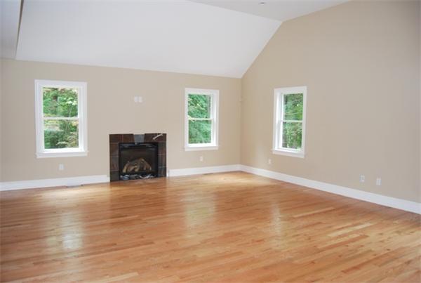 26 Patterson Road Lexington, MA 02421 - Photo 7 of 22 an empty room with windows and a fireplace