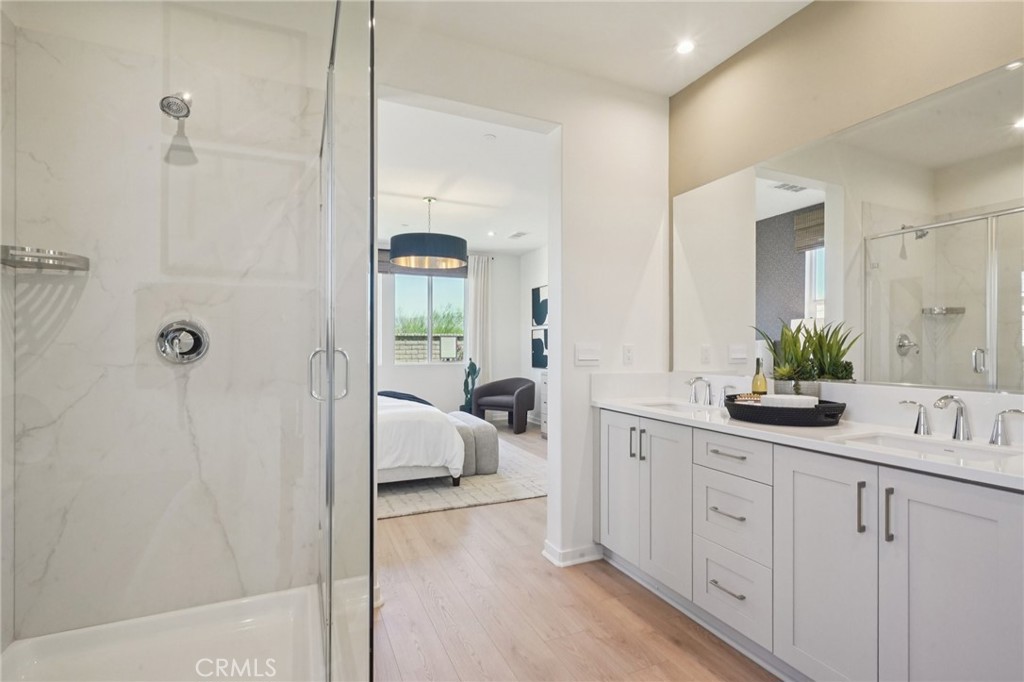 73550 Raphael Drive Palm Desert, CA 92211 - Photo 20 of 41 a en suite bathroom with a double vanity sink and mirror