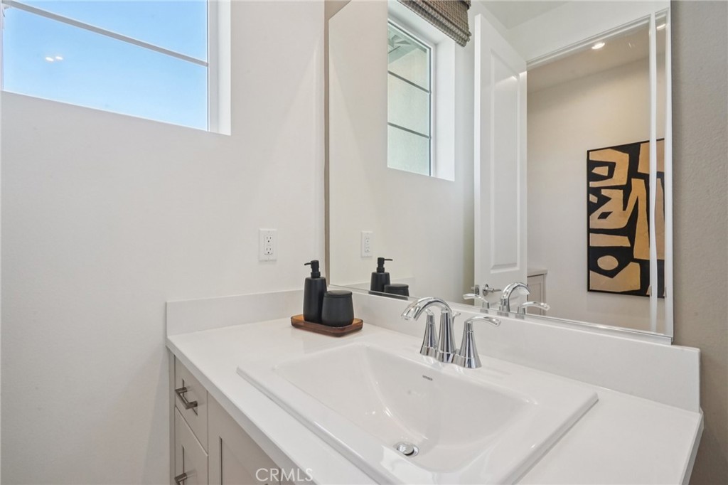 73550 Raphael Drive Palm Desert, CA 92211 - Photo 27 of 41 a bathroom with a sink and a mirror