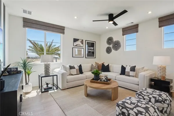 a living room with furniture and a large window