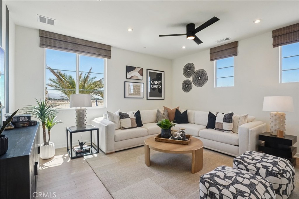 73550 Raphael Drive Palm Desert, CA 92211 - Photo 2 of 41 a living room with furniture and a large window