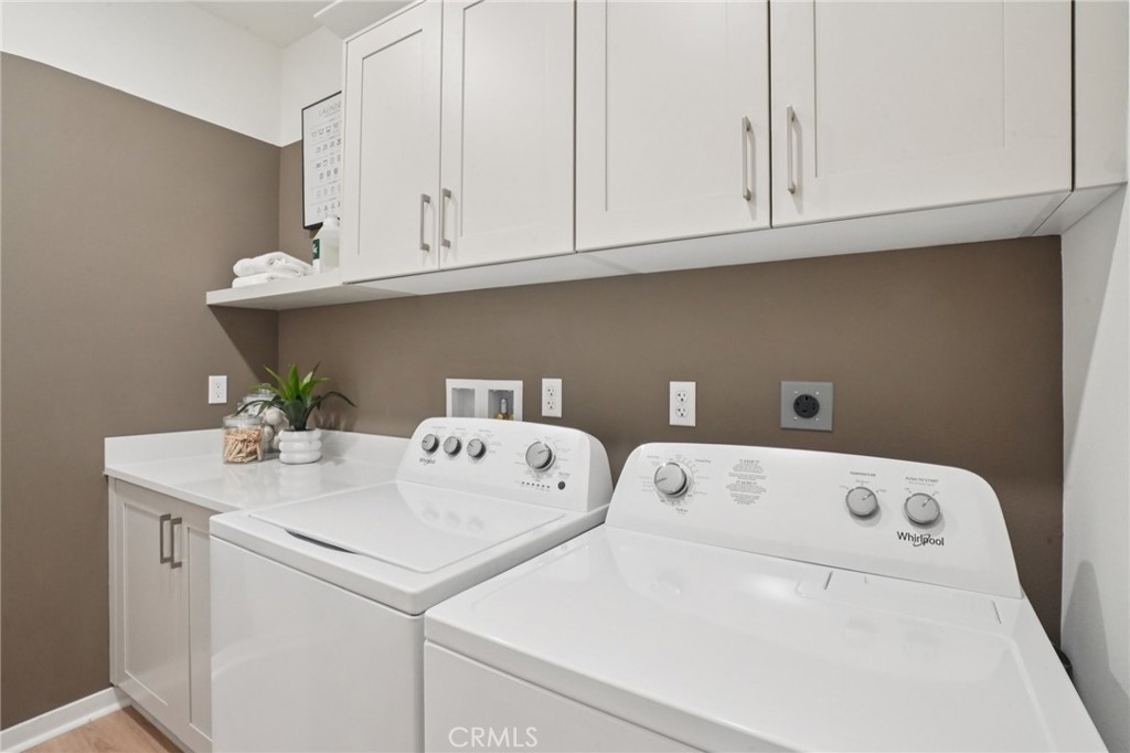 73550 Raphael Drive Palm Desert, CA 92211 - Photo 35 of 41 a utility room with dryer and washer