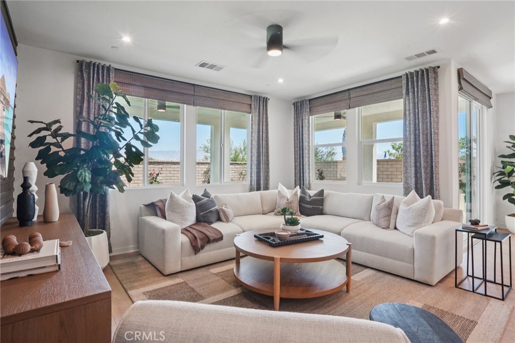 73550 Raphael Drive Palm Desert, CA 92211 - Photo 6 of 41 a living room with furniture and a large window