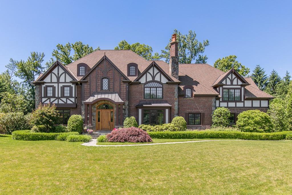6 Brittany Cl, Unit CLOSE Scarsdale, NY 10583 - Photo 1 of 1 a front view of a house with garden