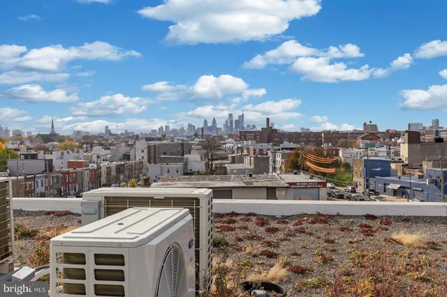 a view of a balcony with city view