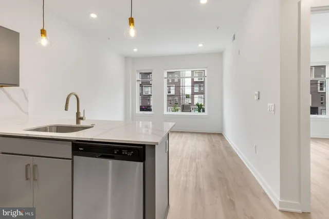 a kitchen with windows and sink