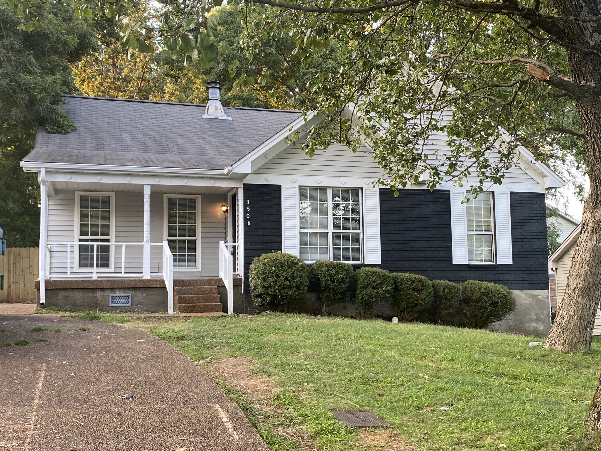 front view of a house with a yard